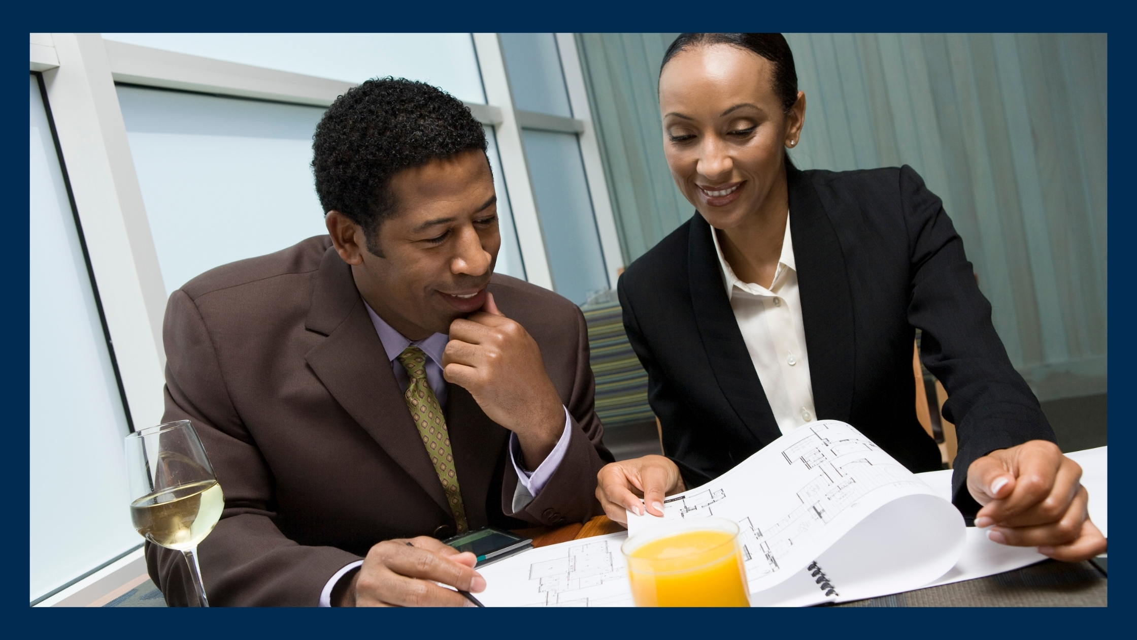 1-2 A man and a woman discussing a business deal