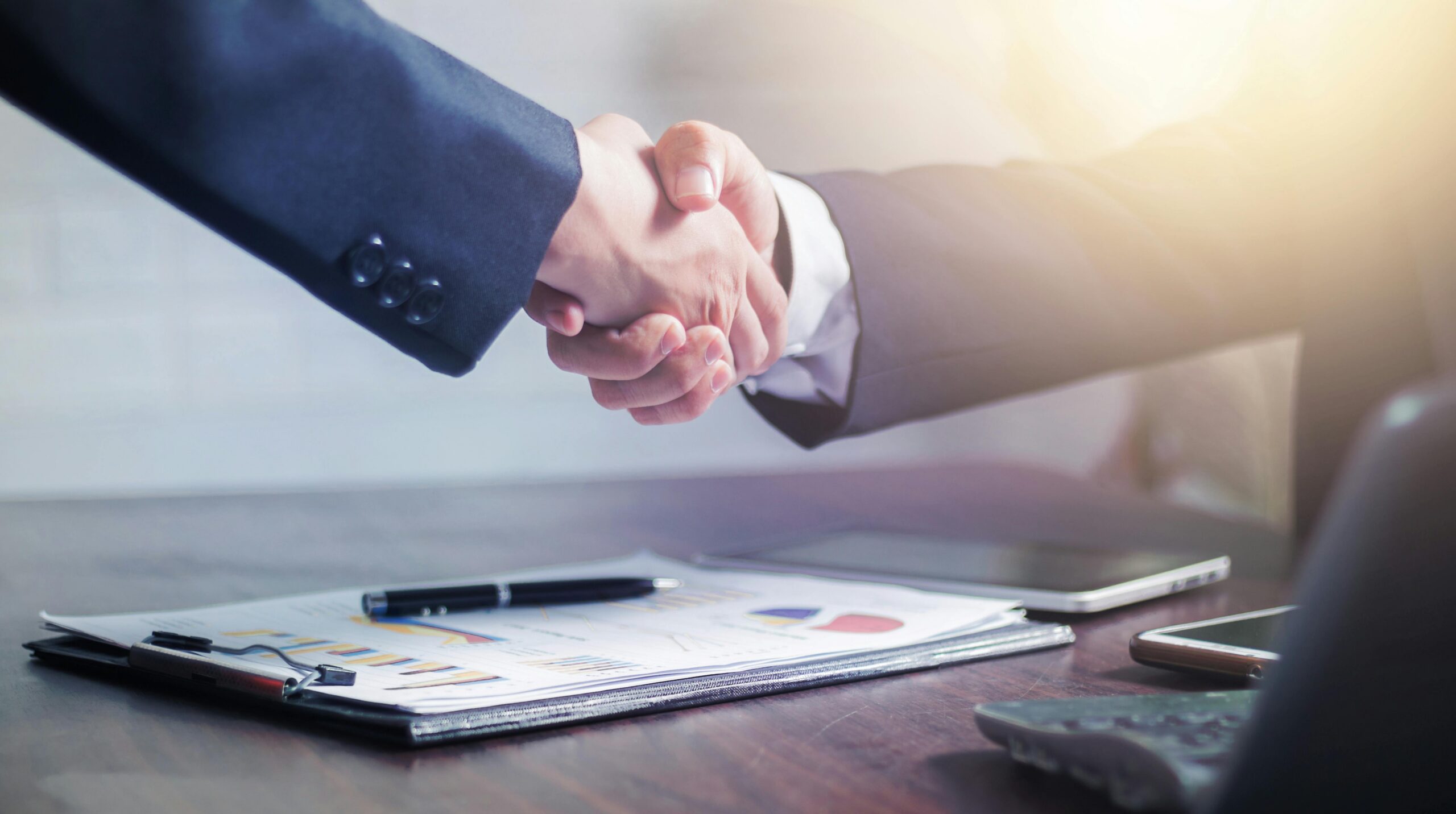 shaking hands in business business broker referral